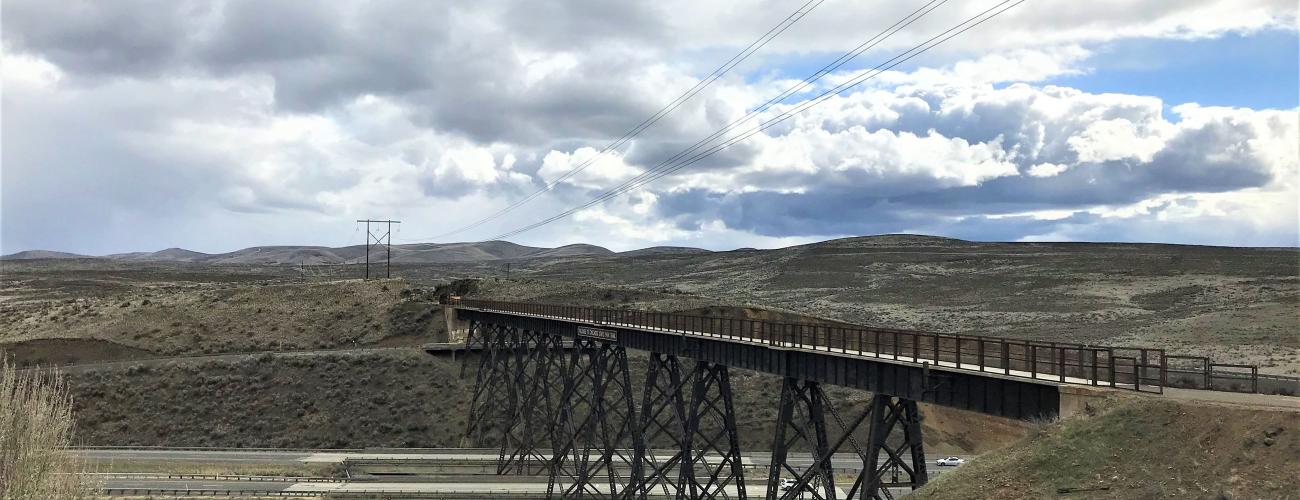 Sage brush covered hills with bridge crossing highway