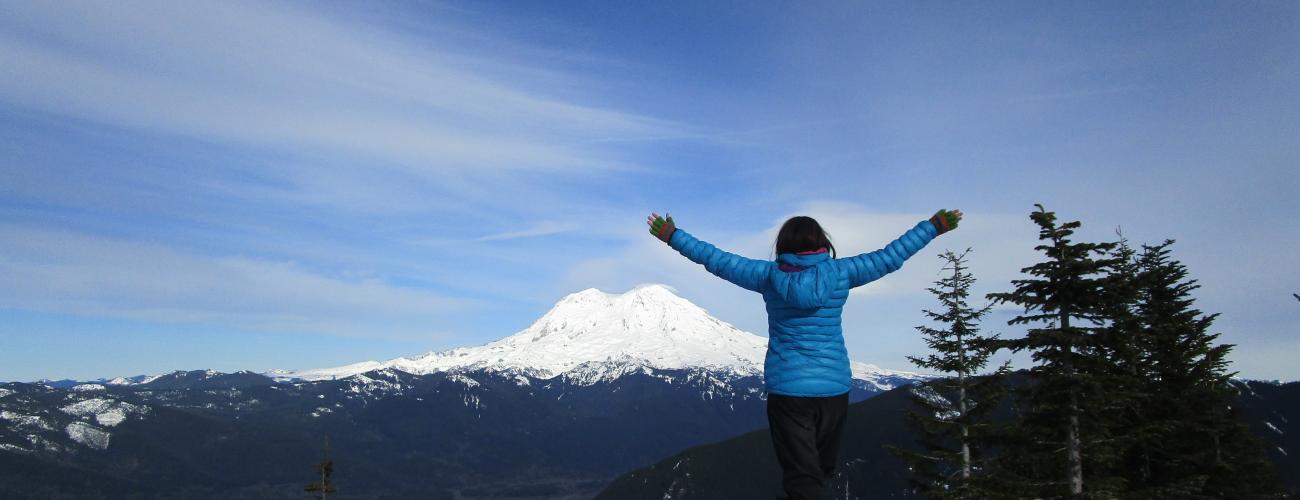 Hiker in front of Mount Adams