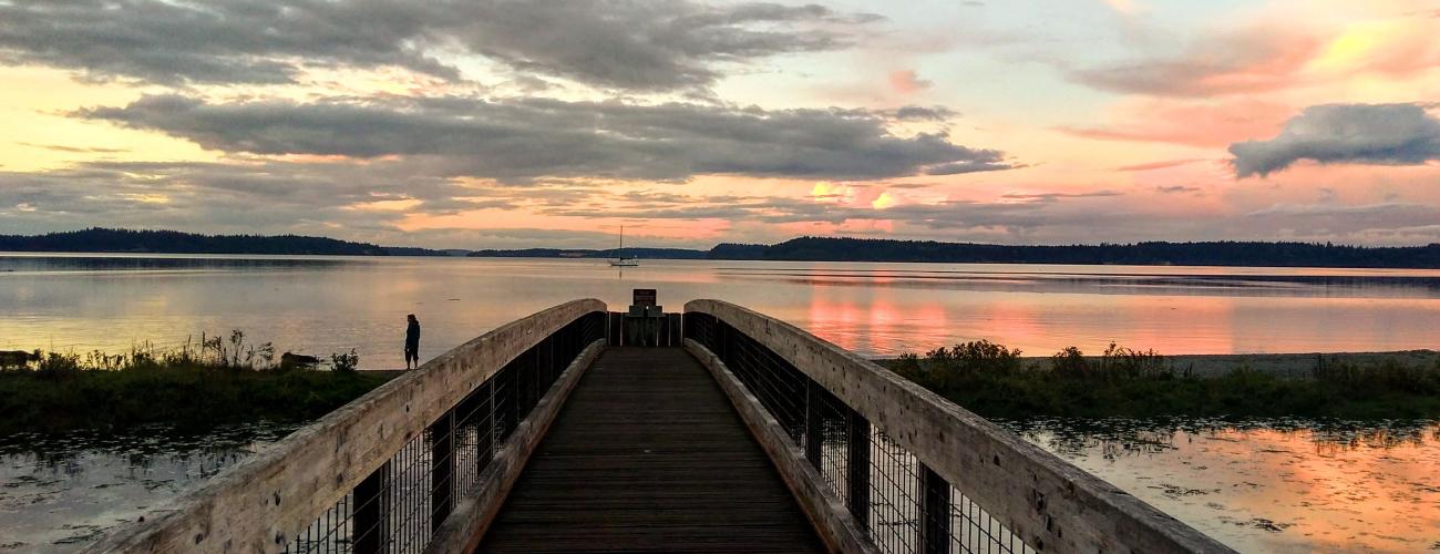 Bridge over water at sunset