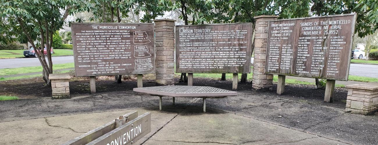 wooden signs with a list of names and text