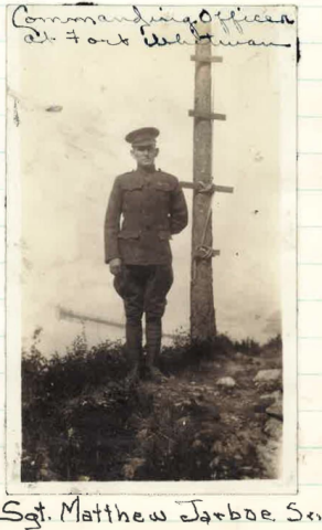 Sepia image of man in uniform with written caption