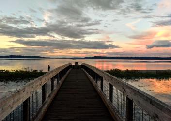 Bridge over water at sunset