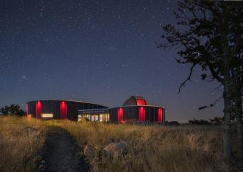 building with starlit skies above