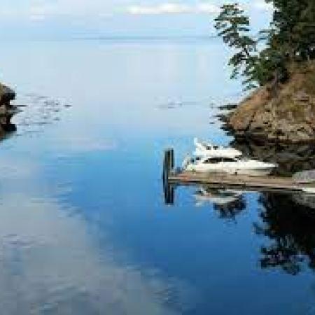 Inlet cove with blue water and boat parked at dock