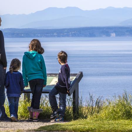 Family at interpretive panel.