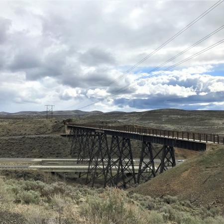 Sage brush covered hills with bridge crossing highway