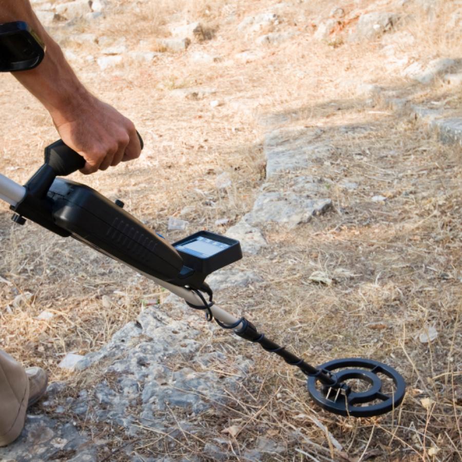 Man metal detecting.