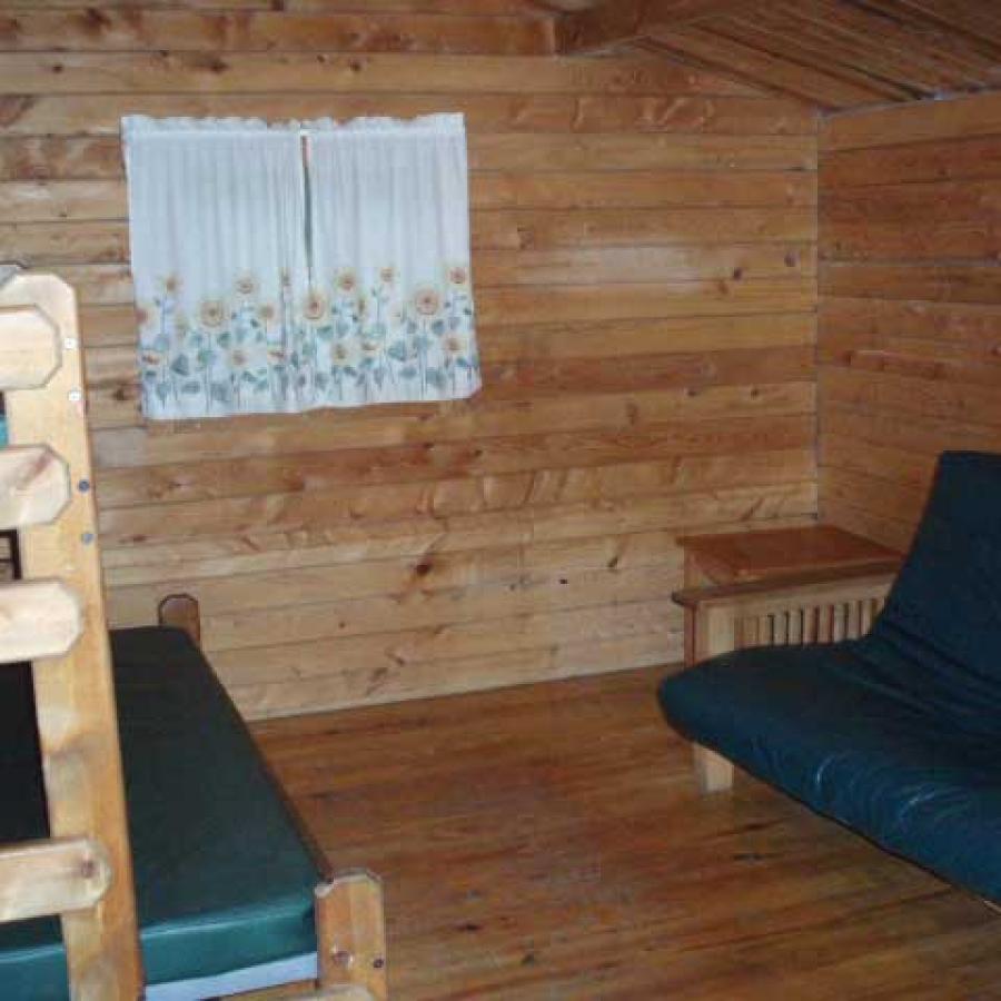 Inside cabin bunk bed and couch.