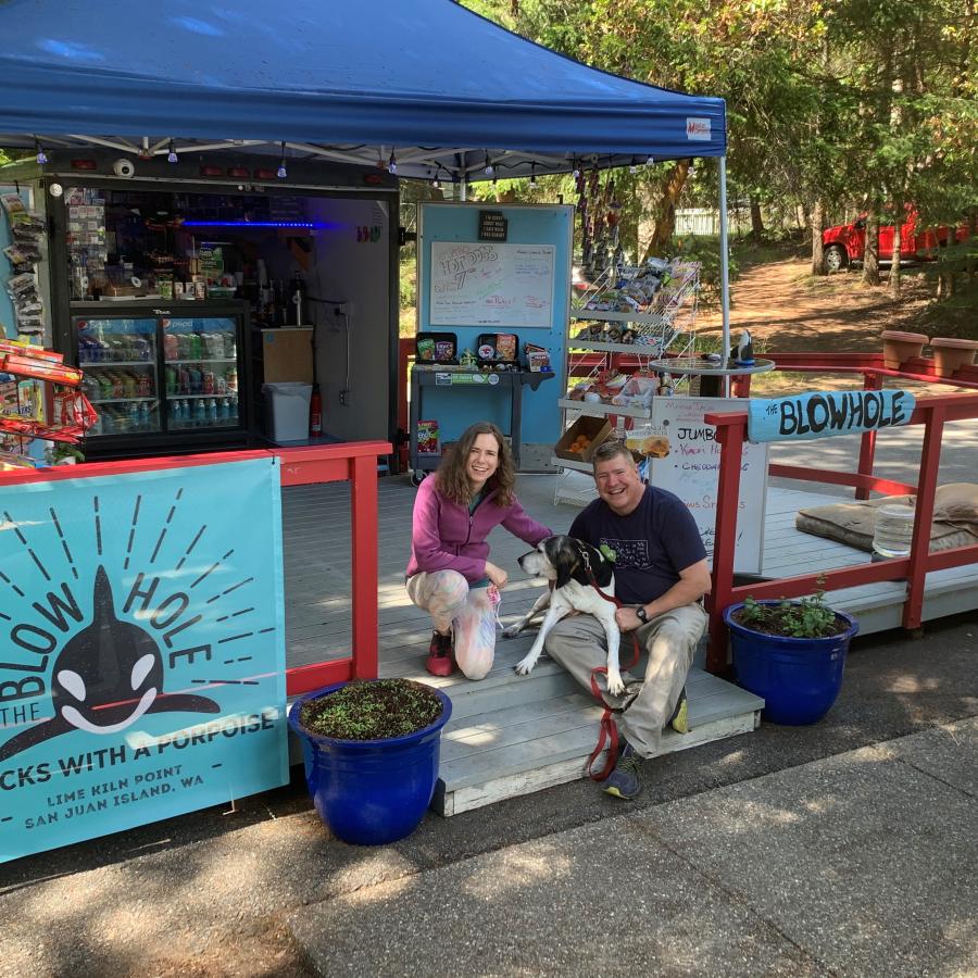 Concession stand with people and dog