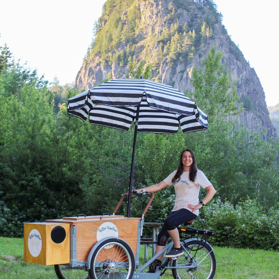 Ice cream cart with umbrella and Beacon Rock in the background