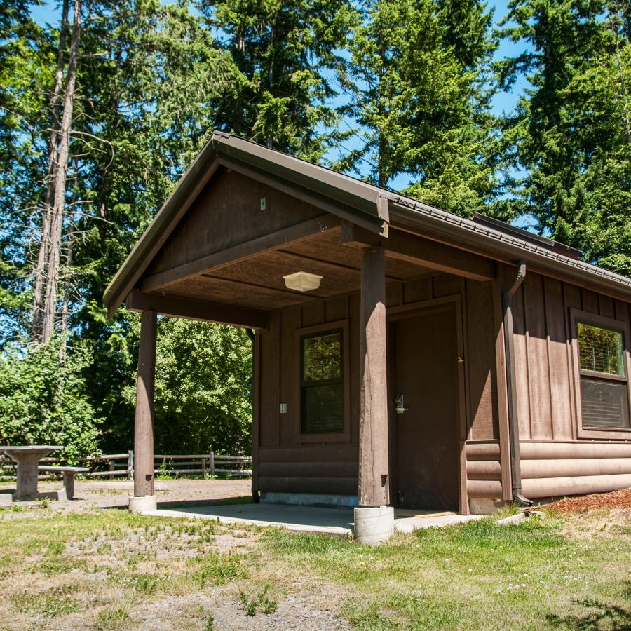 Kitsap Memorial cabin green grass picnic tables forest douglas fir trees