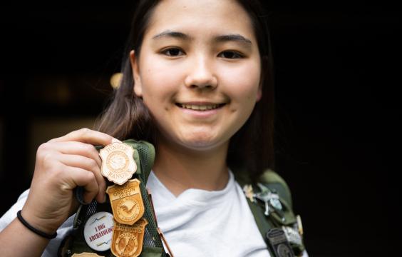 Girl with Junior Ranger Badge.