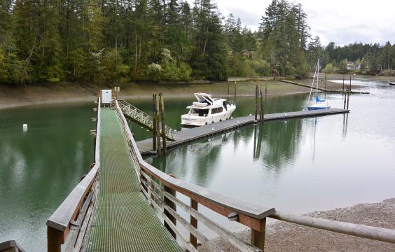 Dock with boat in lagoon