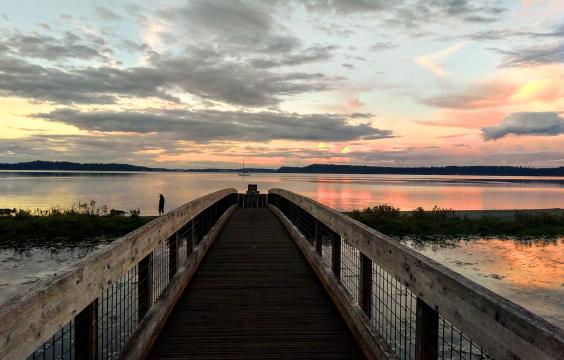 Bridge over water at sunset